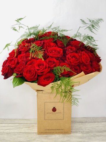 <h2>50 Red Rose Handtied Bouquet Hand-Delivered</h2>
<br>
<ul>
<li>Approximate Dimensions: 50cm x 50cm</li>
<li>Flowers arranged by hand and gift wrapped in our signature eco-friendly packaging and finished off with a hidden wooden ladybird</li>
<li>To give you the best occasionally we may make substitutes</li>
<li>Our flowers backed by our 7 days freshness guarantee</li>
<li>For delivery area coverage see below</li>
</ul>
<br>
<h2>Flower Delivery Coverage</h2>
<p>Our shop delivers flowers to the following Liverpool postcodes L1 L2 L3 L4 L5 L6 L7 L8 L11 L12 L13 L14 L15 L16 L17 L18 L19 L24 L25 L26 L27 L36 L70 If your order is for an area outside of these we can organise delivery for you through our network of florists. We will ask them to make as close as possible to the image but because of the difference in stock and sundry items it may not be exact.</p>
<br>
<h2>Hand-tied Bouquet | 50 Red Roses</h2>
<p>Fifty of the most exquisite long-stemmed large-headed Red Roses will be arranged by hand to create this stunningly hand-tied bouquet which will remain in their heart forever.</p>
<p>The beautiful red roses are hand-arranged by our professional florists into a hand-tied bouquet to make the perfect gift for any occasion.</p>
<p>Handtied bouquets are a lovely display of fresh flowers that have the wow factor. The advantage of having a bouquet made this way is that they are artfully arranged by our florists and tied so that they stay in the display.</p>
<p>They are then gift wrapped and aqua packed in a water bubble so that at no point are the flowers out of water. This means they look their very best on the day they arrive and continue to delight for days after.</p>
<p>Being delivered in a transporter box and in water means the recipient does not need to put the flowers in a vase straight away they can just put them down and enjoy.</p>
<p>Featuring 50 luxury large-headed red roses, together with mixed seasonal foliages.</p>
<br>
<h2>Eco-Friendly Liverpool Florists</h2>
<p>As florists we feel very close earth and want to protect it. Plastic waste is a huge problem in the florist industry so we made the decision to make our packaging eco-friendly.</p>
<p>To achieve this we worked with our packaging supplier to remove the lamination off our boxes and wrap the tops in an Eco Flowerwrap which means it easily compostable or can be fully recycled.</p>
<p>Once you have finished enjoying your flowers from us they will go back into growing more flowers! Only a small amount of plastic is used as a water bubble and this is biodegradable.</p>
<p>Even the sachet of flower food included with your bouquet is compostable.</p>
<p>All our bouquets have small wooden ladybird hidden amongst them so do not forget to spot the ladybird and post a picture on our social media pages to enter our rolling competition.</p>
<br>
<h2>Flowers Guaranteed for 7 Days</h2>
<p>Our 7-day freshness guarantee should give you confidence that we will only send out good quality flowers.</p>
<p>Leave it in our hands we will create a marvellous bouquet which will not only look good on arrival but will continue to delight as the flowers bloom.</p>
<br>
<h2>Liverpool Flower Delivery</h2>
<p>We are open 7 days a week and offer advanced booking flower delivery same-day flower delivery 3-hour flower delivery. Guaranteed AM PM or Evening Flower Delivery and also offer Sunday Flower Delivery.</p>
<p>Our florists deliver in Liverpool and can provide flowers for you in Liverpool Merseyside. And through our network of florists can organise flower deliveries for you nationwide.</p>
<br>
<h2>The Best Florist in Liverpool your local Liverpool Flower Shop</h2>
<p>Come to Booker Flowers and Gifts Liverpool for your beautiful flowers and plants. For that bit of extra luxury we also offer a lovely range of finishing touches such as wines champagne locally crafted Gin and Rum Vases Scented Candles and Chocolates that can be delivered with your flowers.</p>
<p>To see the full range see our extras section.</p>
<p>You can trust Booker Flowers and Gifts of delivery the very best for you.</p>
<p><br /><br /></p>
<p><em>5 Star review on Yell.com</em></p>
<br>
<p><em>Thank you Gemma for your fabulous service. The flowers are of the highest quality and delivered with a warm smile. My sister was delighted. Ordering was simple and the communications were top-notch. I will definitely use your services again.</em></p>